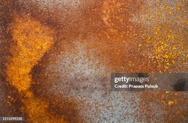 rust surface. close up of black rust on an old sheet of metal texture. - nieten stock-fotos und bilder