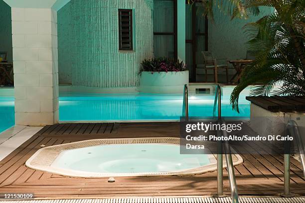 hot tub and swimming pool in hotel - hot tub stock pictures, royalty-free photos & images