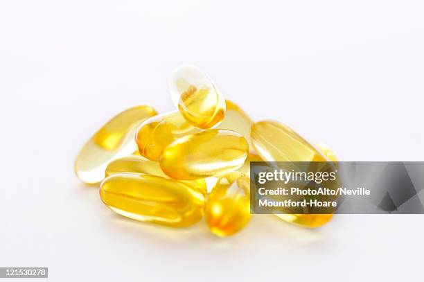 cod liver oil capsules - cod liver oil stock pictures, royalty-free photos & images