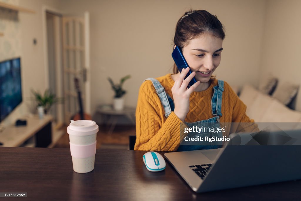 Making A Work Call Young Woman Making A Business Call From Her Home Office High-Res Stock ...