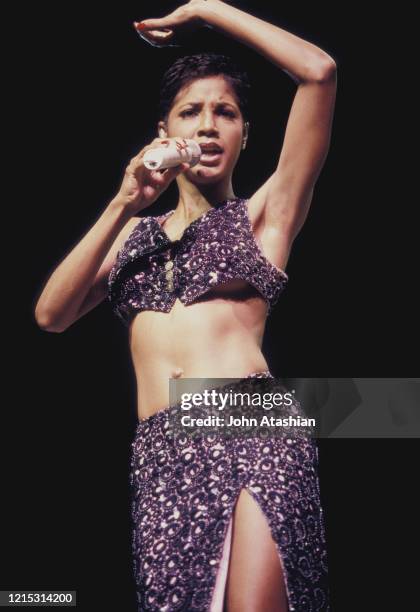 Singer Toni Braxton is shown performing on stage during a live concert appearance on February 8, 1997.