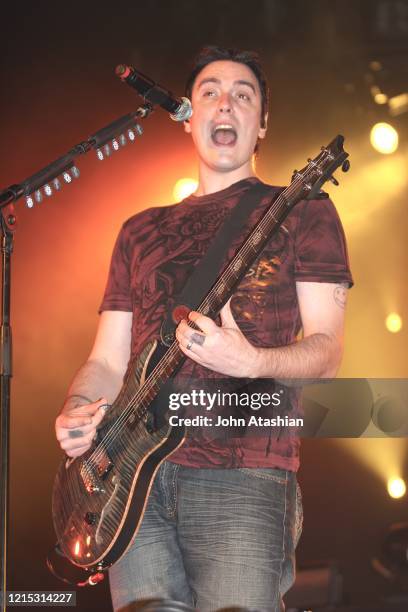 Guitarist and vocalist Benjamin Burnley is shown performing on stage during a live concert appearance with Breaking Benjamin on February 16, 2010.