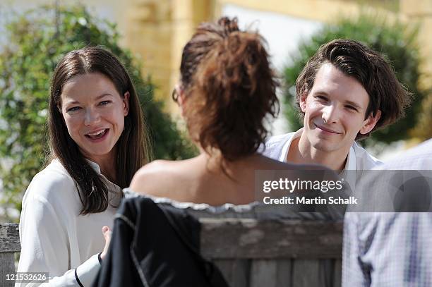 Hannah Herzsprung and Sabin Tambrea are seen during a TV interview at the photocall for the Ludwig II movie at Castle Hof on August 20, 2011 in Hof...