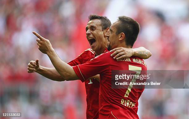 Franck Ribery and Rafinha of Bayern Muenchen celebrate Ribery's first goal during the Bundesliga match between FC Bayern Muenchen and Hamburger SV at...