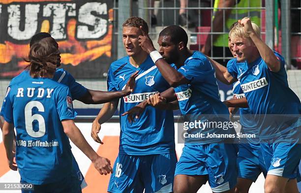 Ryan Babel of Hoffenheim celebrates with his team mates after scoring his team's first goal during the Bundesliga match between FC Augsburg and 1899...