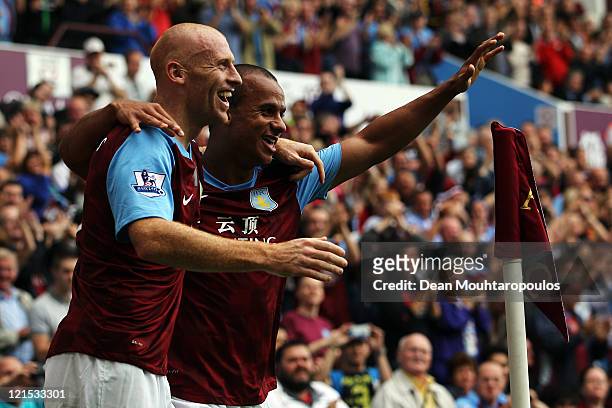 Gabriel Agbonlahor of Aston Villa celebrates scoring the first goal of the game with James Collins during the Barclays Premier League match between...