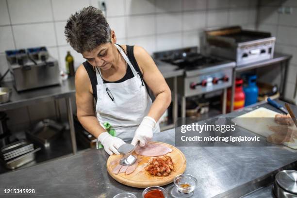 chef working at commercial kitchen - meat tenderiser stock pictures, royalty-free photos & images