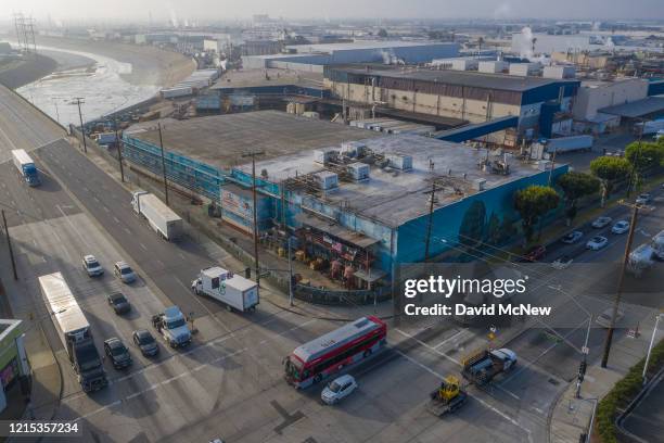 An aerial view shows the Farmer John slaughterhouse, near the Los Angeles River, after 153 workers tested positive for COVID-19, on May 26, 2020 in...