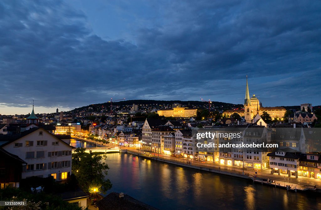 Zurich Niederdorf at night with golden city lights