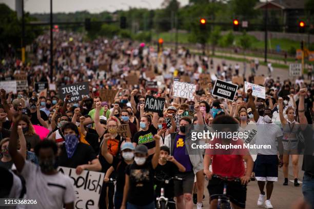 Protesters march on Hiawatha Avenue while decrying the killing of George Floyd on May 26, 2020 in Minneapolis, Minnesota. Four Minneapolis police...