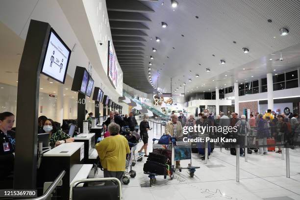 New Zealand passengers from the Vasco Da Gama cruise ship wait to check in for their Air New Zealand flight to Auckland at Perth International...