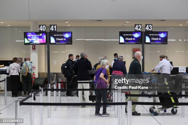 New Zealand passengers from the Vasco Da Gama cruise ship check in for their Air New Zealand flight to Auckland at Perth International Airport after...