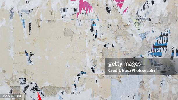 scratched posters on a wall - newspaper texture stock pictures, royalty-free photos & images