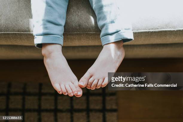 child's feet - kids feet in home stock pictures, royalty-free photos & images