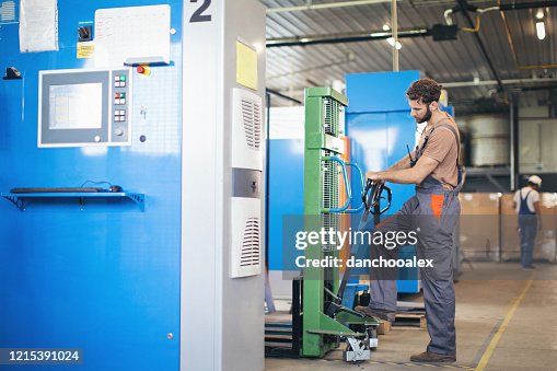 Man Checking Machine Young Man In The Factory Using And Checking Machines High-Res Stock ...