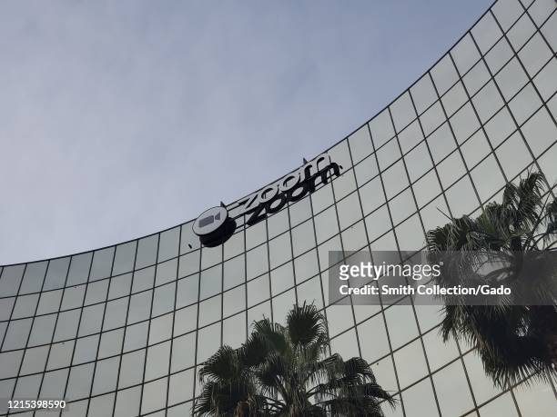 Facade with sign at headquarters of videoconferencing, remote work, and webinar technology company Zoom in the Silicon Valley, San Jose, California,...