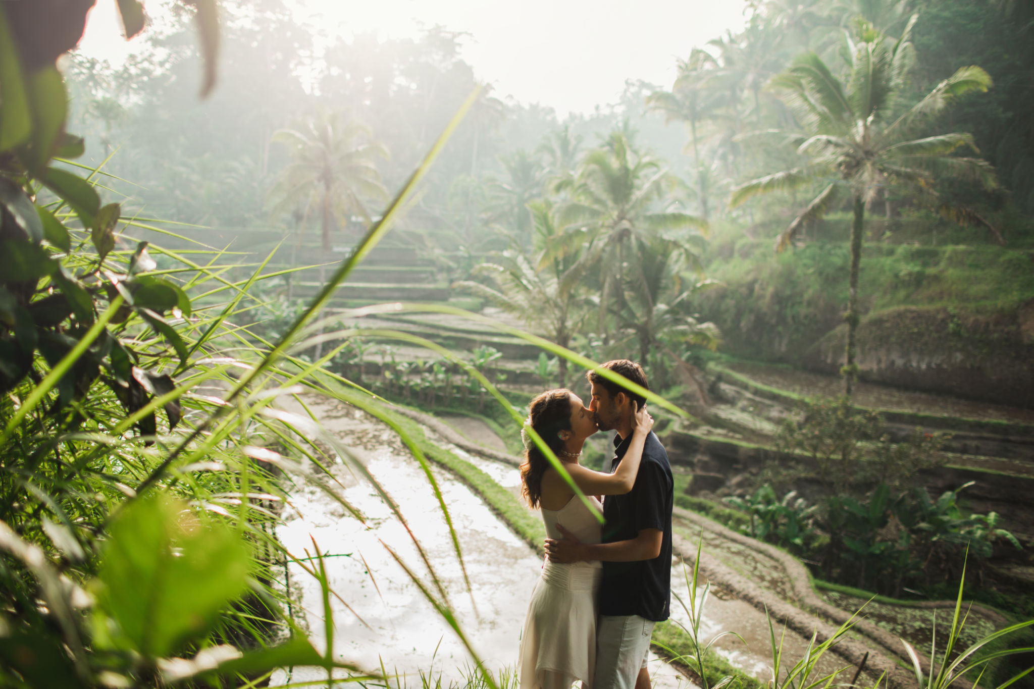 Young latin american couple with amazing view of Ubud rice terraces in morning. Happy together, honeymoon in Bali. Travel lifestyle. Young latin american couple with amazing view of Ubud rice terraces in morning. Happy together, honeymoon in Bali. Travel lifestyle.
