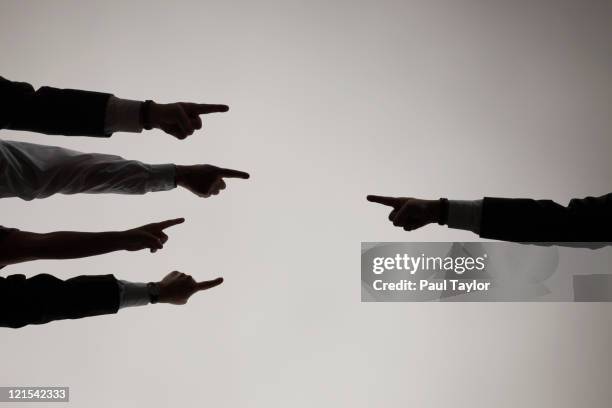 fingers pointing each other - blame stock pictures, royalty-free photos & images