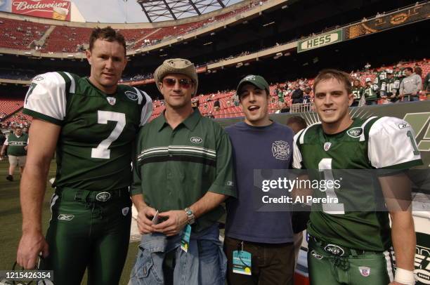 Christopher Meloni and Jason Biggs speak with New York Jets players Ben Graham and Mike Nugent when they attend the New York Jets vs San Diego...