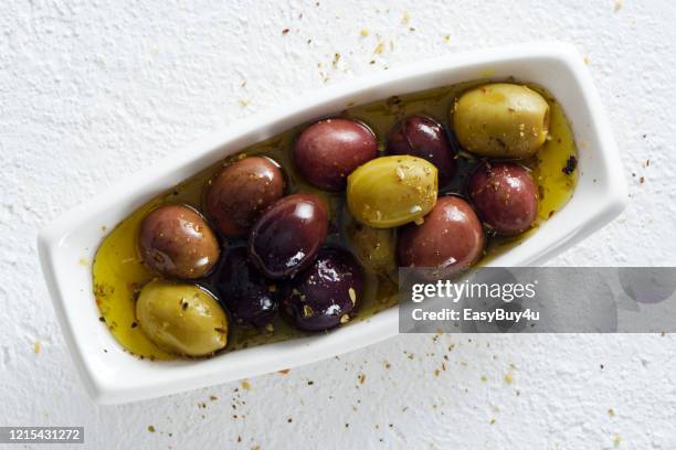 green and black olives - olive oil bowl stock pictures, royalty-free photos & images