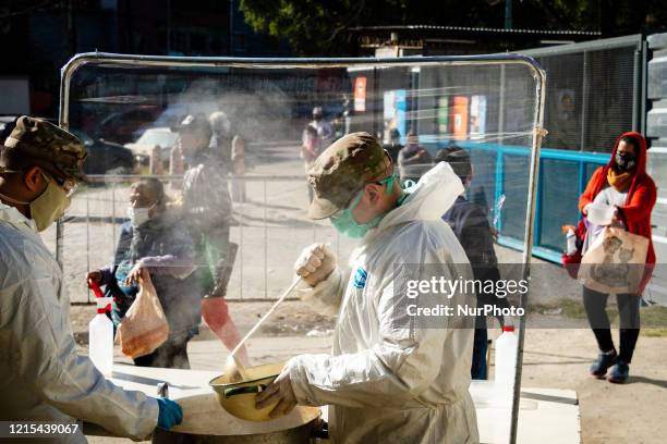 Armed forces distribute food to the citizens of the slum 1-11-14 one of the poorest settlements in Buenos Aires, Argentina, on May 26, 2020.