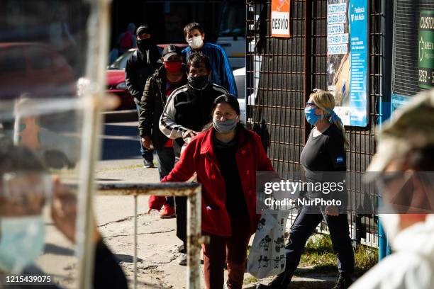 Long lines to receive food for the citizens of the slum 1-11-14 one of the poorest settlements in Buenos Aires, Argentina, on May 26, 2020.