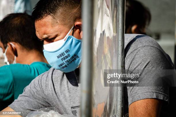 Volunteers from the neighborhood Parish distribute food in Buenos Aires, Argentina, on May 26, 2020.