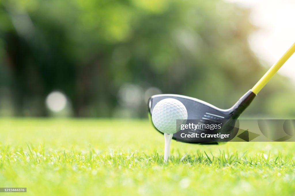 The golf ball 's preparing for a great strike.