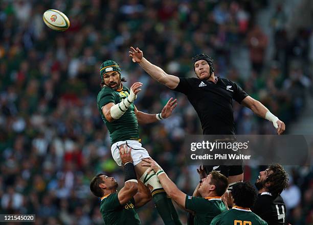 Victor Matfield of the Springboks and Ali Williams of the All Blacks contest the ball in the lineout during the Tri Nations Test match between the...