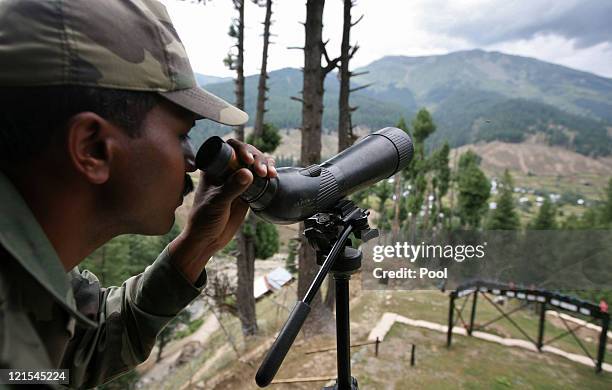An Indian Army soldier guards the line of control, the line dividing Kashmir between India and Pakistan after the Indian Army killed 12 suspected...
