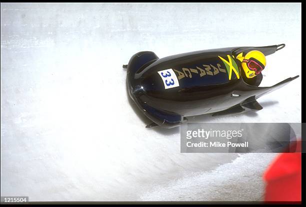 D STOKES AND M WHITE IN ACTION FOR JAMAICA I DURING THE TWO MAN BOBSLEIGH COMPETITION AT THE 1988 WINTER OLYMPICS IN CALGARY.