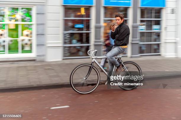 surfing on bicycle - bike headset stock pictures, royalty-free photos & images
