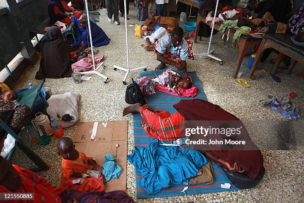 Drought and famine refugees lie in an overflow area of the Banadir hospital on August 20, 2011 in Mogadishu, Somalia. The UN estimates that more than...