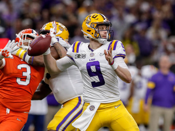 Quarterback Joe Burrow of the LSU Tigers on a pass play during the College Football Playoff National Championship game against the Clemson Tigers at...