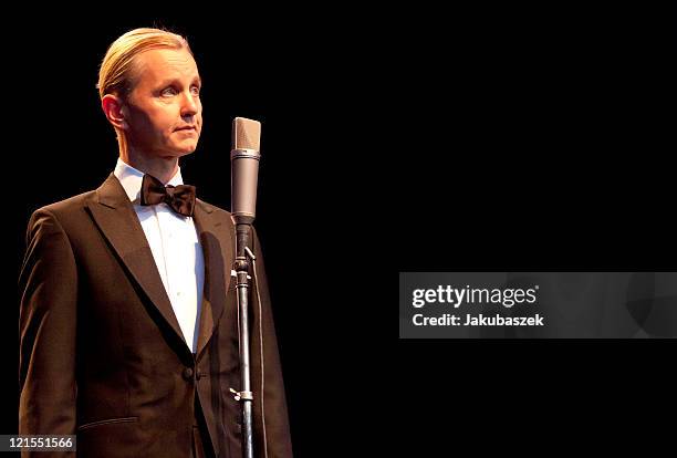 German singer Max Raabe performs live with his Palast Orchester during a concert at the Waldbuehne on August 20, 2011 in Berlin, Germany.