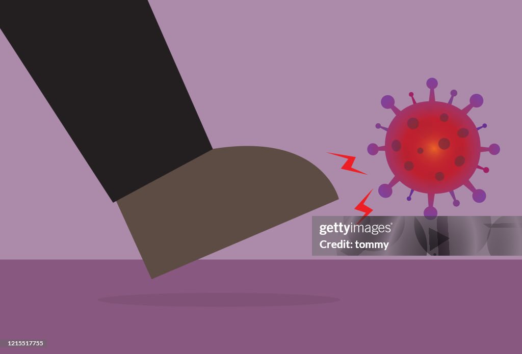 Businessman kicking a virus