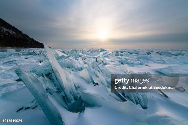 the frozen baikal lake in winter, russia. - lake baikal stock pictures, royalty-free photos & images