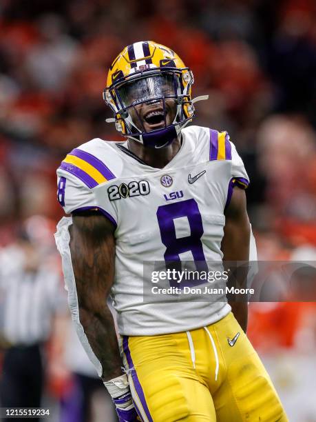 Linebacker Patrick Queen of the LSU Tigers celebrates after making a tackle during the College Football Playoff National Championship game against...