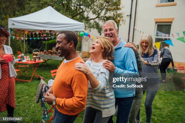 come on and do the conga - conga line dancing stock pictures, royalty-free photos & images