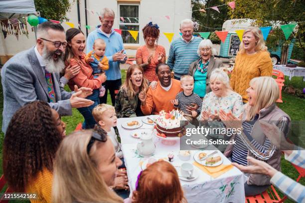 singing happy birthday - family singing stock pictures, royalty-free photos & images