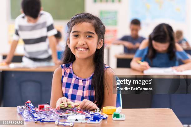 elementary school student learning about circuits stock photo - kid experiment stock pictures, royalty-free photos & images