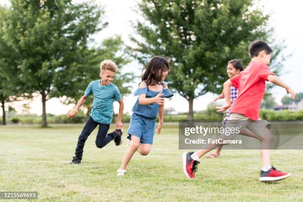 elementary school students play at recess stock photo - tag 11 stock pictures, royalty-free photos & images