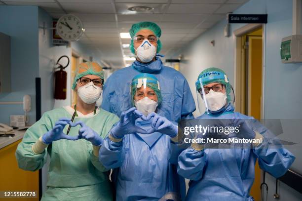 Nurses making the hearth sign at Cremona Hospital on March 29, 2020 in Cremona, Italy. The Italian government continues to enforce the nationwide...