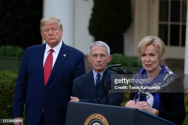 President Donald Trump and Anthony Fauci, Director of the National Institute of Allergy and Infectious Diseases, listen to White House coronavirus...