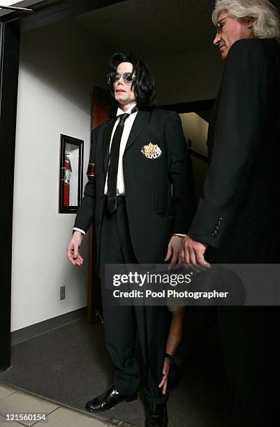 Michael Jackson goes through security as he prepares to enter Santa Barbara County Superior Court in Santa Maria, Calif., with his attorney Thomas...