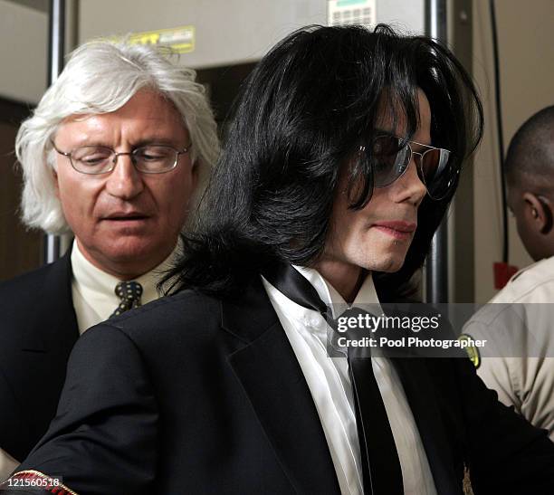 Michael Jackson goes through security as he prepares to enter Santa Barbara County Superior Court in Santa Maria, Calif., with his attorney Thomas...