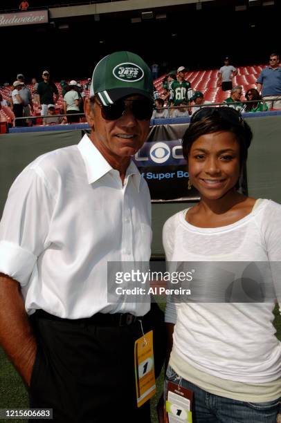 Joe Namath meets with former Olympian Dominique Dawes when they attend the New York Jets vs New England Patriots game at The Meadownlands on...