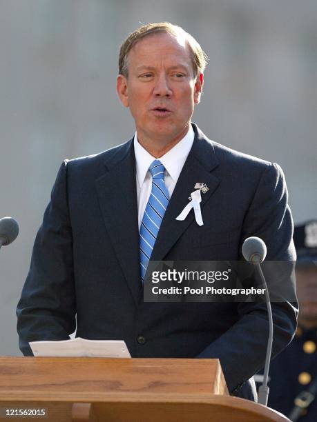 New York Governor George Pataki, reading "I Think Continually of Those Who Were Trully Great" by Stephen Spender during a ceremony marking the two...