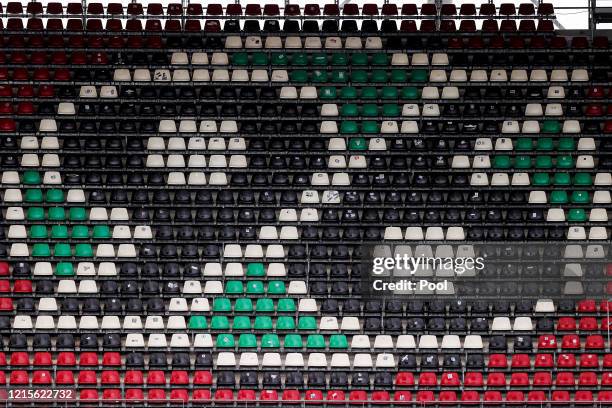 The logo of Hannover 96 is seen on empty seats prior to the Second Bundesliga match between Hannover 96 and Karlsruher SC at HDI-Arena on May 27,...