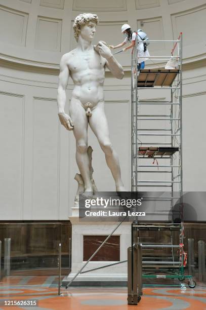 Restorer cleans Michelangelo's David statue while preparing for the reopening of the Galleria dell'Accademia which was closed for almost three months...